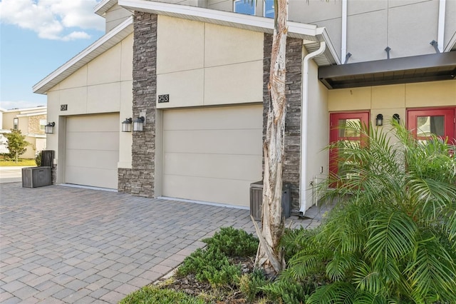 view of side of property featuring a garage