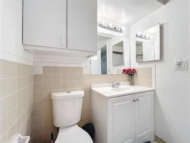 half bathroom with toilet and vanity