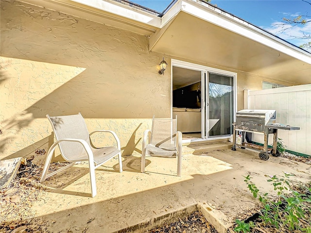 view of patio / terrace featuring fence and area for grilling