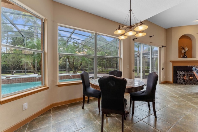 dining room with a wealth of natural light and a notable chandelier