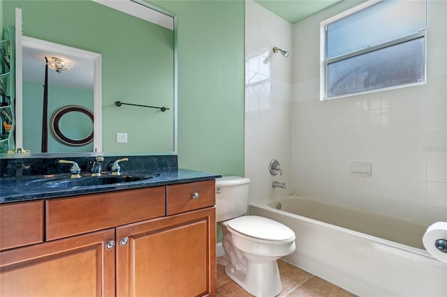 full bathroom with tile patterned floors, vanity, toilet, and tiled shower / bath combo