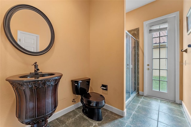 bathroom featuring tile patterned floors, a healthy amount of sunlight, and walk in shower