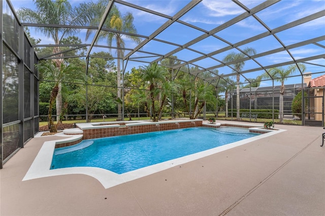 view of swimming pool with glass enclosure, an in ground hot tub, and a patio