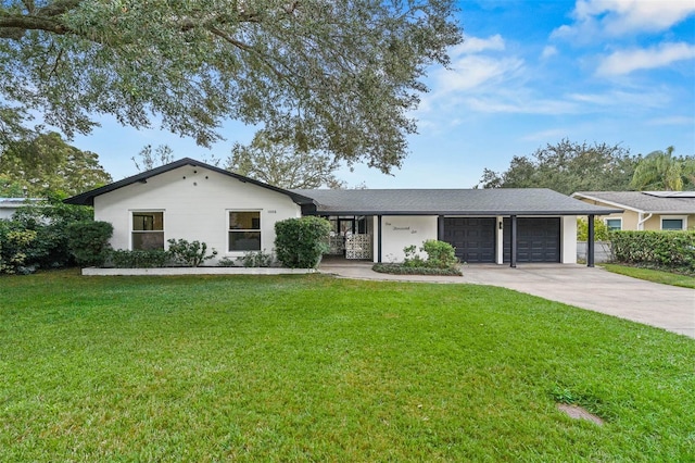 single story home featuring a garage and a front lawn