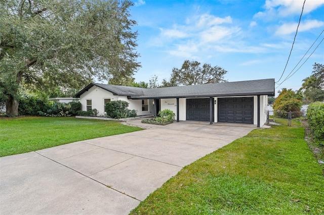 ranch-style home featuring a front yard and a garage