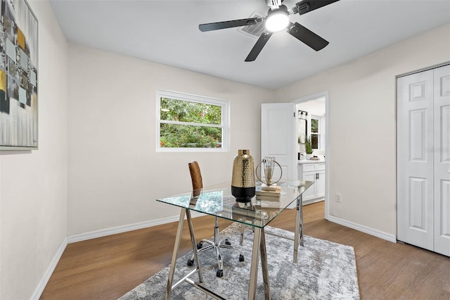 office area featuring wood-type flooring and ceiling fan