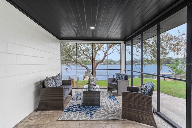 sunroom with a water view and wood ceiling