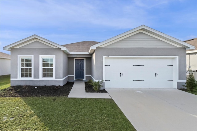 ranch-style home with a front lawn and a garage