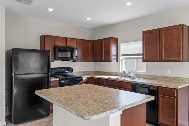 kitchen featuring light tile patterned floors, sink, a kitchen island, and black appliances