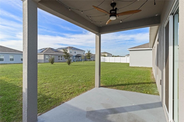 view of yard featuring ceiling fan and a patio area