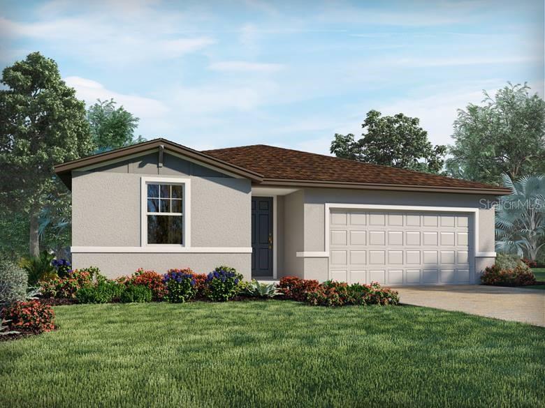 view of front of house featuring a garage and a front lawn