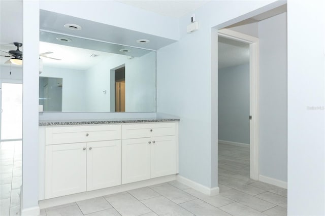 bathroom with tile patterned floors, ceiling fan, and vanity