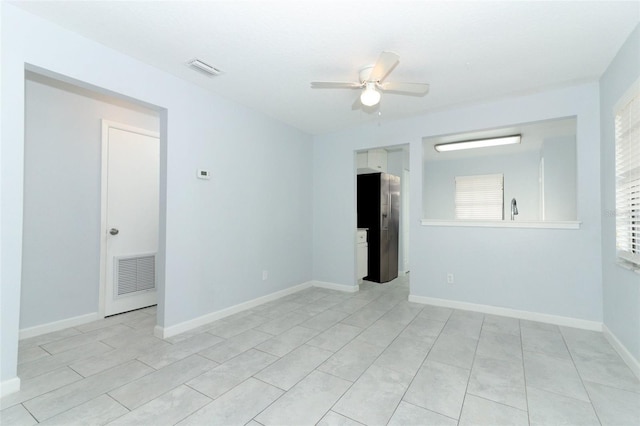 empty room with plenty of natural light and ceiling fan