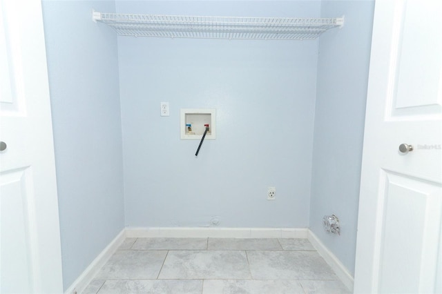 laundry room featuring hookup for a gas dryer, light tile patterned flooring, washer hookup, and hookup for an electric dryer