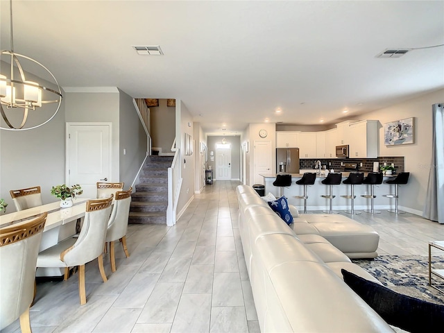 living room with an inviting chandelier