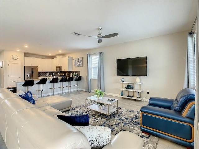 living room featuring ceiling fan