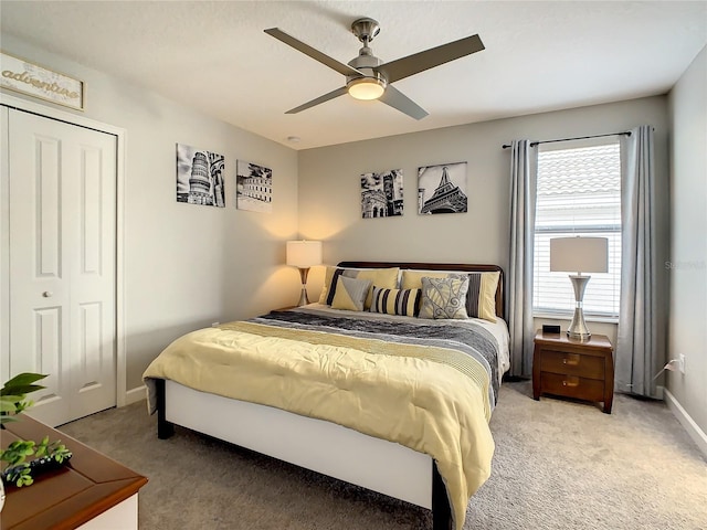 1670 Moon Valley Dr, Davenport, FL 33896 - bedroom with light colored carpet, a closet, and a ceiling fan