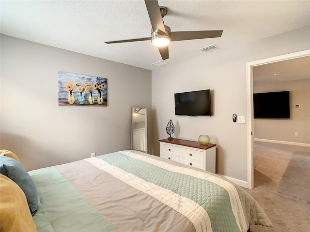 bedroom featuring ceiling fan and light carpet