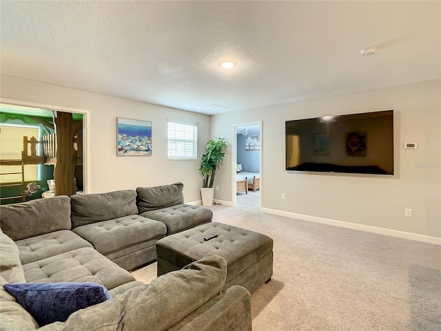 living room with light carpet and a textured ceiling