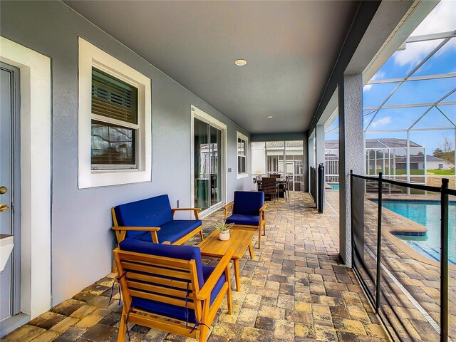 1670 Moon Valley Dr, Davenport, FL 33896 - view of patio / terrace with an outdoor pool, glass enclosure, and an outdoor hangout area
