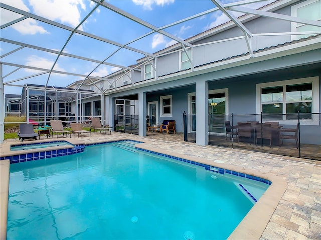 view of swimming pool with a patio area and a lanai