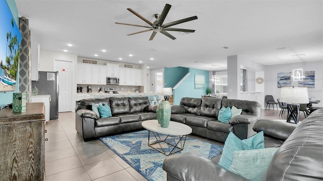 tiled living room with ceiling fan