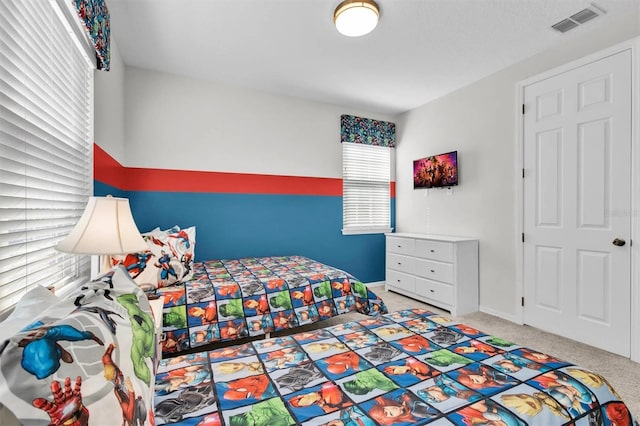 bedroom with light colored carpet