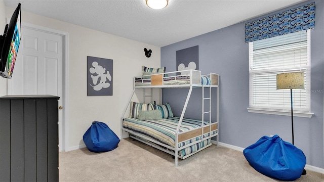 carpeted bedroom with a textured ceiling