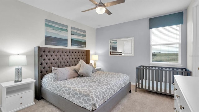 carpeted bedroom with ceiling fan