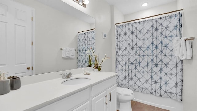 full bathroom with shower / bath combo with shower curtain, tile patterned flooring, vanity, and toilet