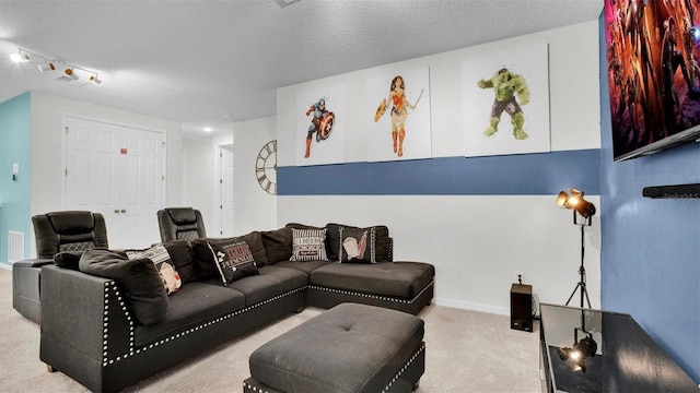 carpeted living room featuring a textured ceiling