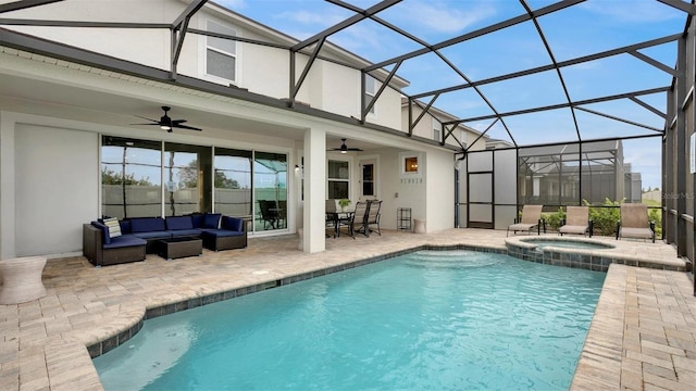 rear view of property with outdoor lounge area, a patio, glass enclosure, and ceiling fan