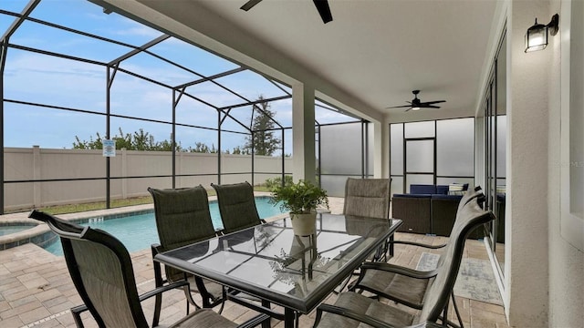 view of patio featuring a pool with hot tub and a lanai