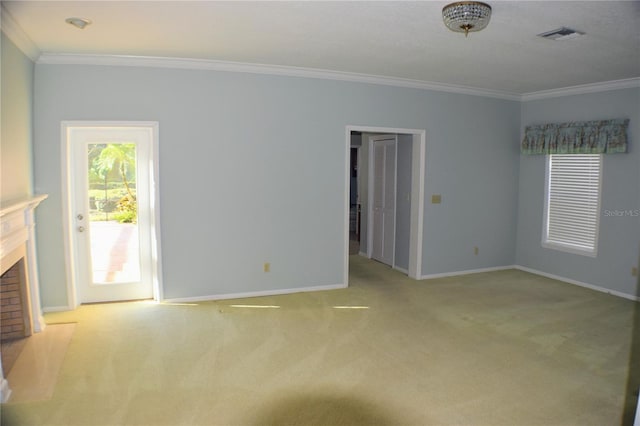 unfurnished living room with ornamental molding and light carpet