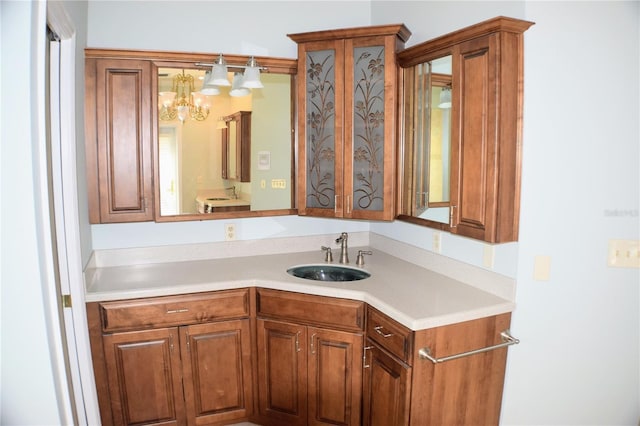 bathroom with vanity and a chandelier