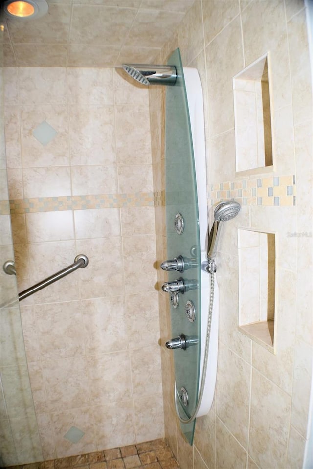 bathroom with a tile shower