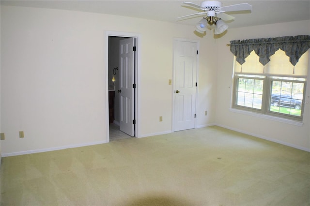 unfurnished bedroom with light carpet and ceiling fan