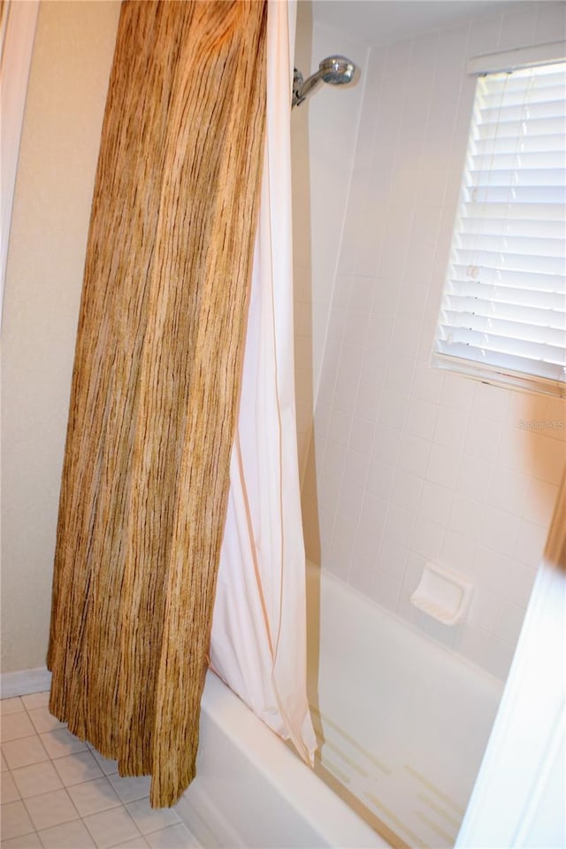 bathroom with tile patterned flooring and shower / tub combo with curtain