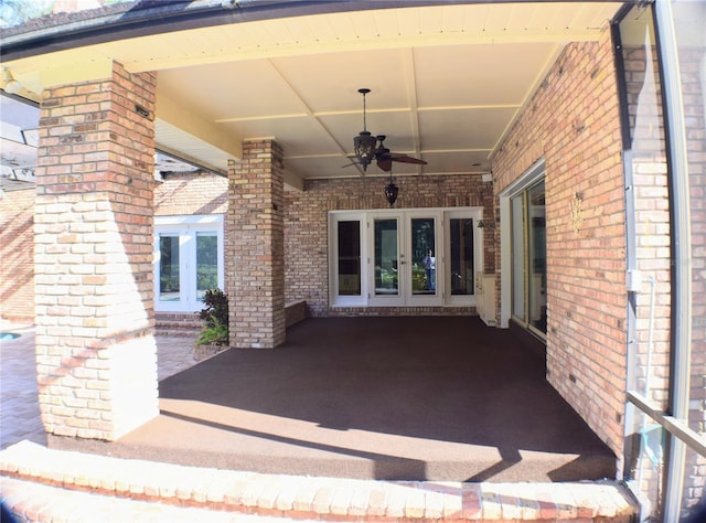 view of patio featuring ceiling fan and french doors