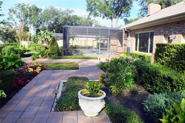 view of yard with a patio and a lanai