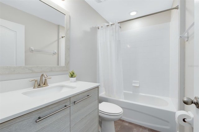 full bathroom featuring tile patterned floors, vanity, shower / bath combination with curtain, and toilet