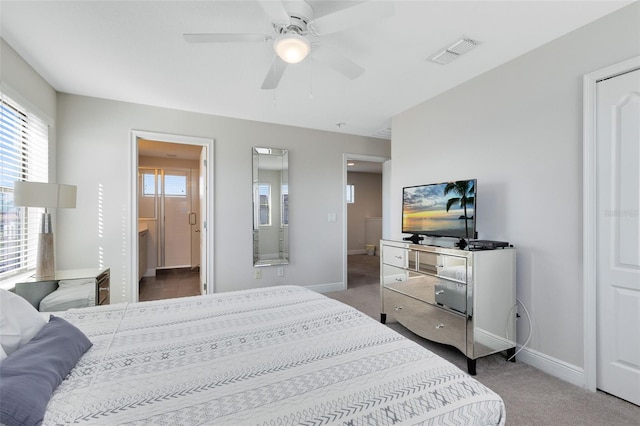 bedroom featuring carpet flooring, ceiling fan, and connected bathroom