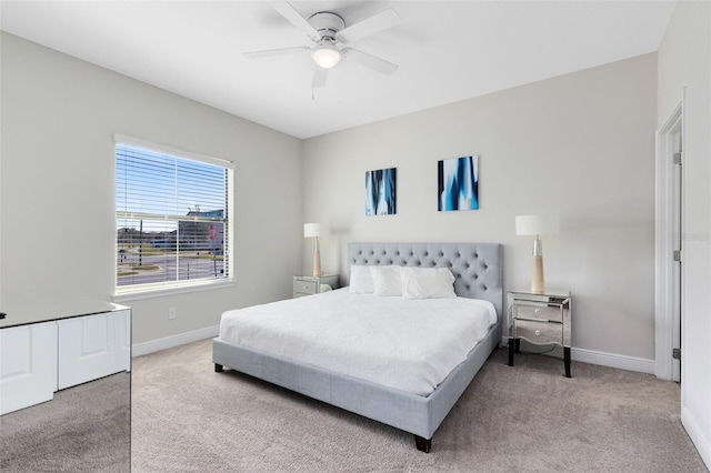 bedroom featuring ceiling fan and light colored carpet