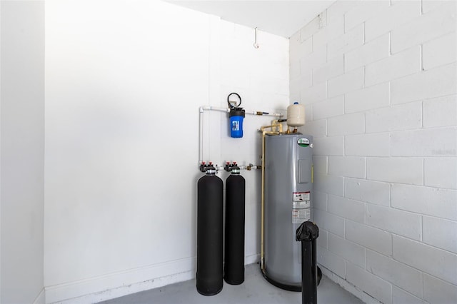 utility room featuring electric water heater