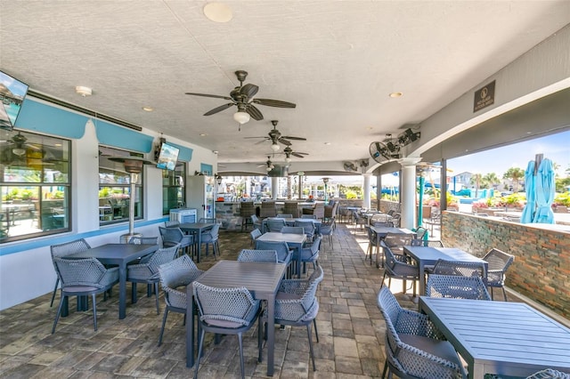 view of patio featuring ceiling fan