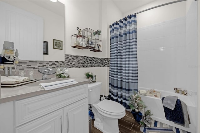 bathroom with wood-type flooring, vanity, and toilet