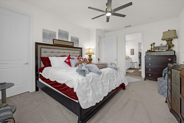 bedroom featuring ceiling fan and light carpet