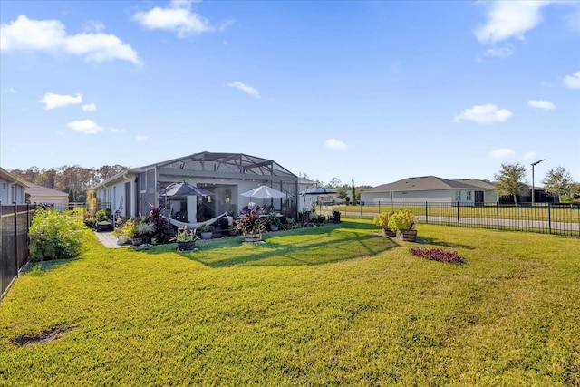 view of yard with a lanai