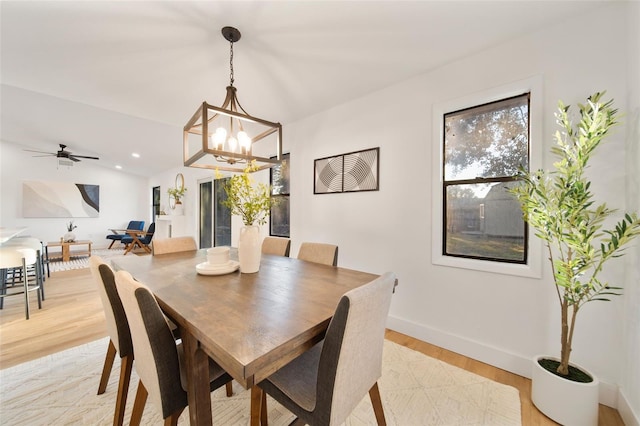 896 Talmadge Ave SE, Palm Bay, FL 32909 - dining space featuring ceiling fan with notable chandelier and light hardwood / wood-style flooring