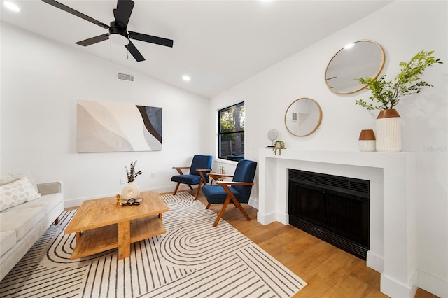 896 Talmadge Ave SE, Palm Bay, FL 32909 - living room with ceiling fan, vaulted ceiling, and light wood-type flooring